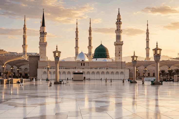 The green dome and minarets of the Prophet’s Mosque at sunrise